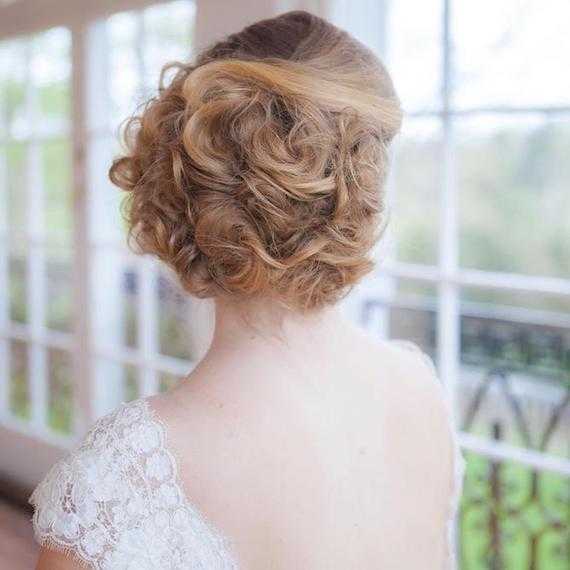 Photo of a bride wearing a chignon wedding hairstyle, created using Wella Professionals